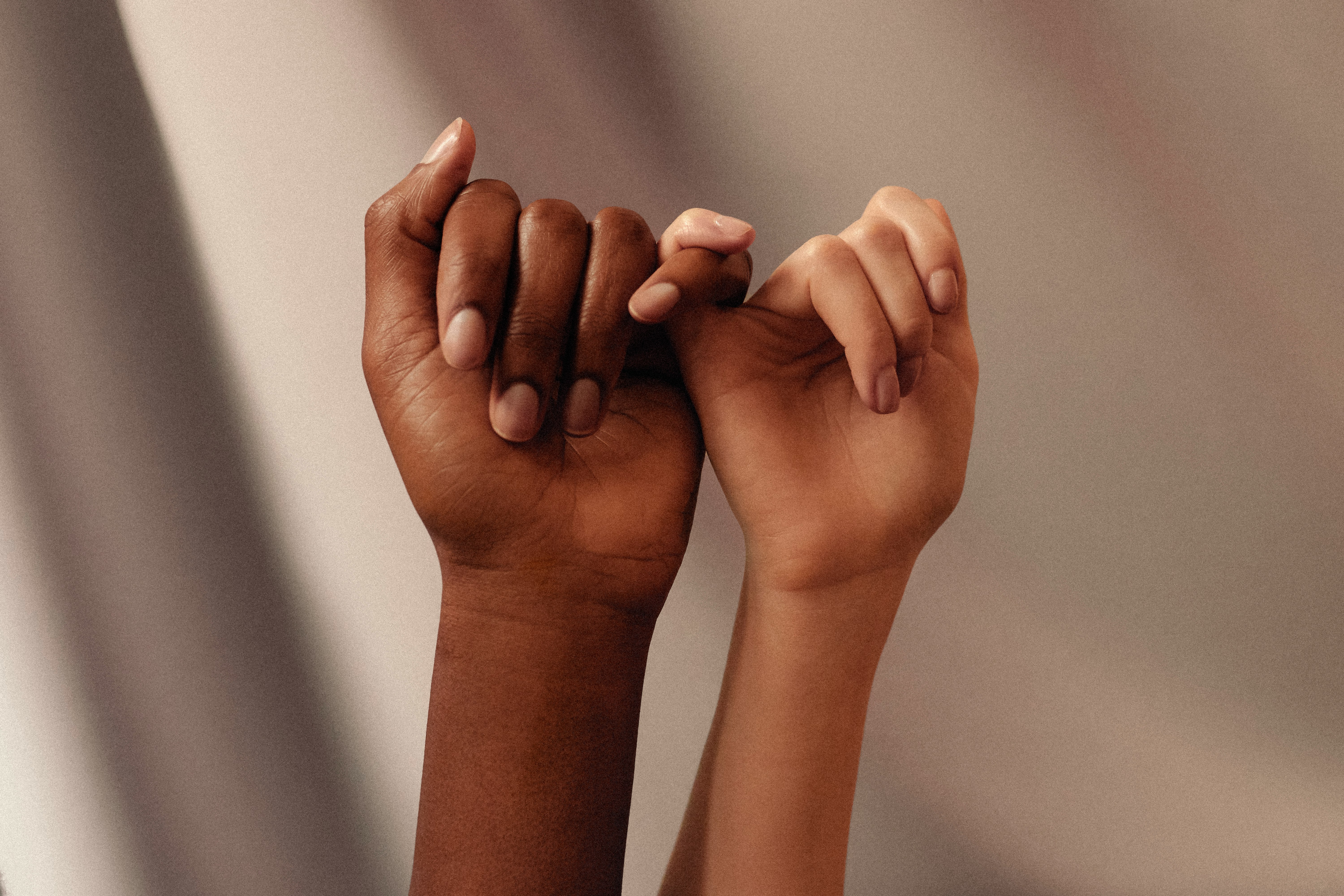 persons hand with white manicure